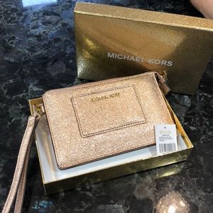 Small Rose Gold metallic Michael Kors wristlet.